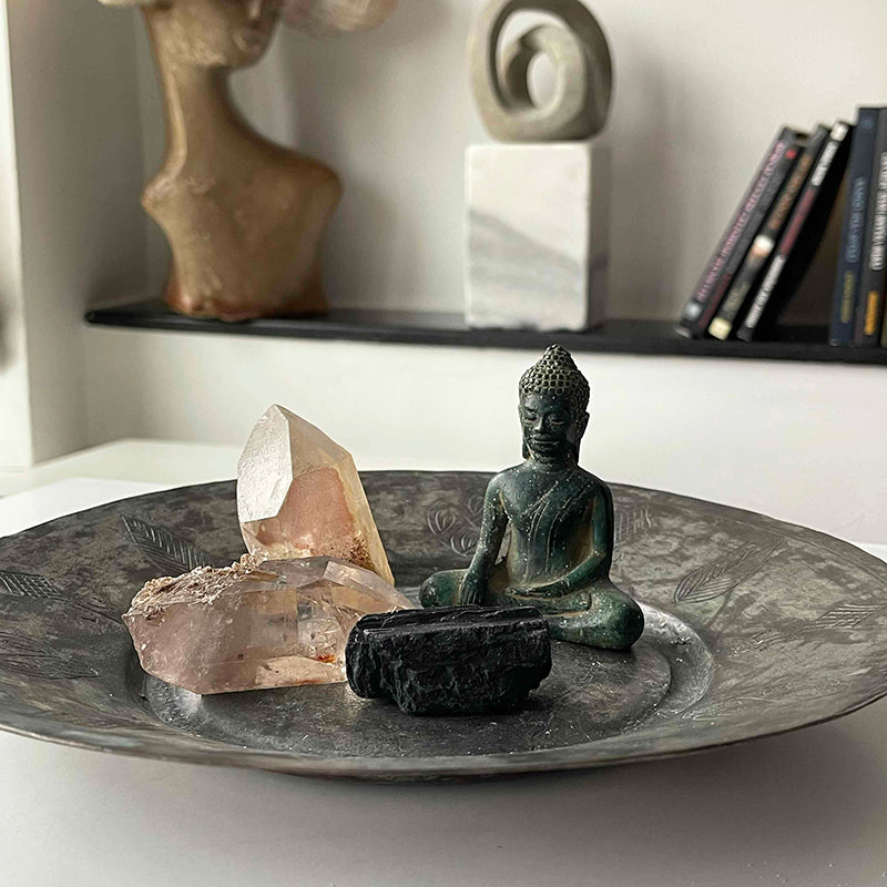 Buddha and crystals on copper tray