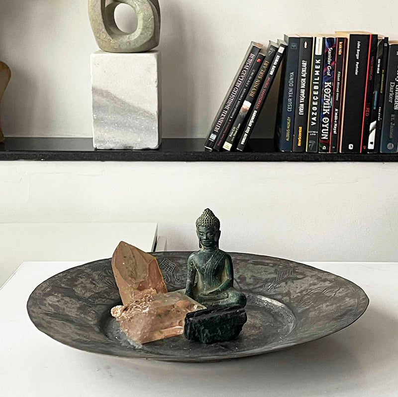 Buddha and crystals on copper tray